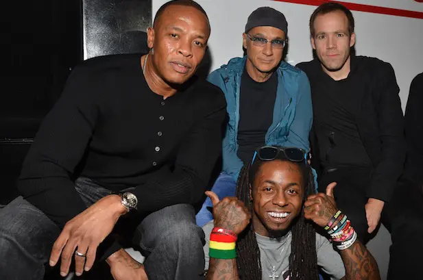 Dr. Dre, Interscope head Jimmy Iovine, president/COO of Beats Electronics Luke Wood, and Lil Wayne