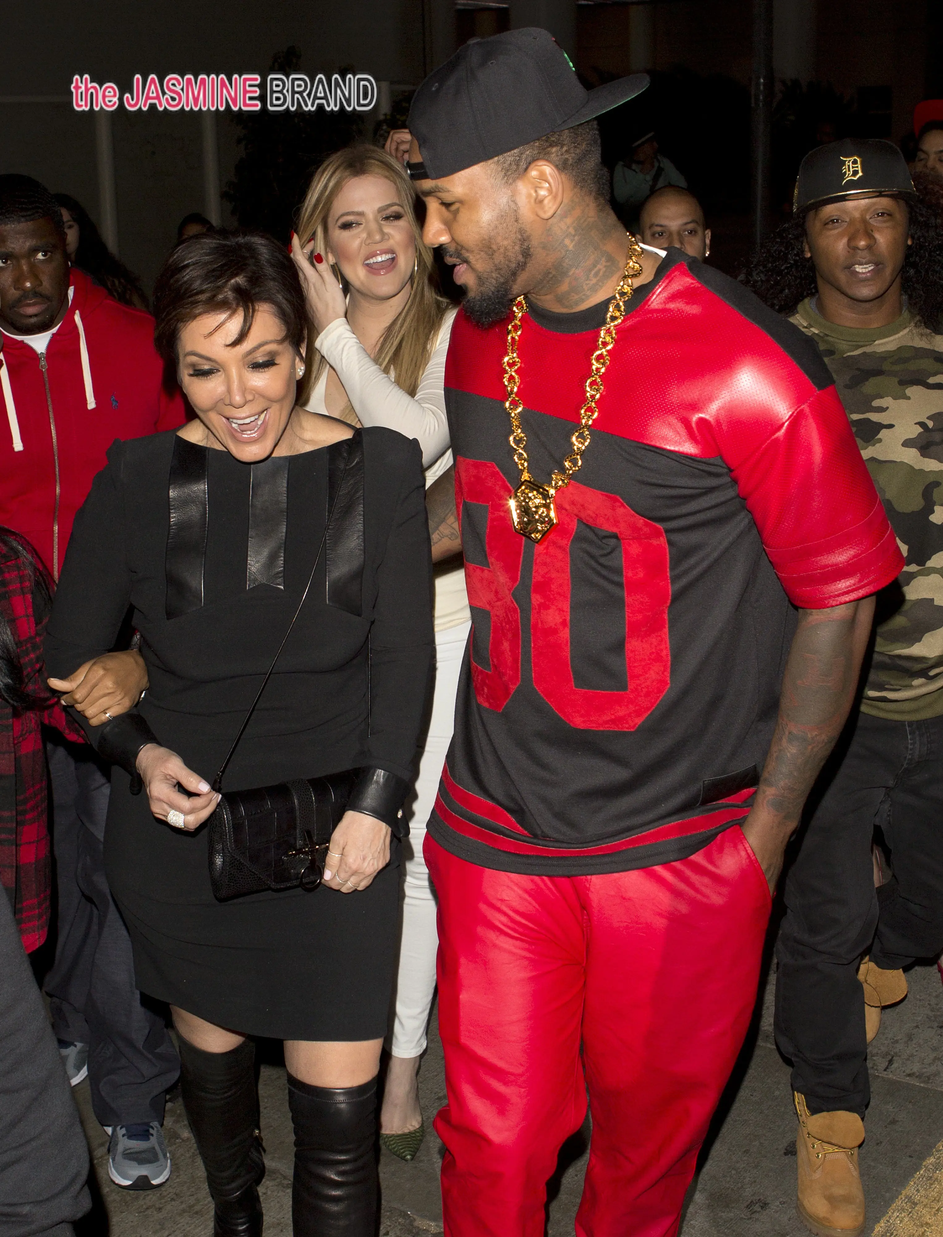 Khloe Kardashian holds hands with rapper The Game as they take mother Kris Jenner to Tru Night club in Hollywood, CA