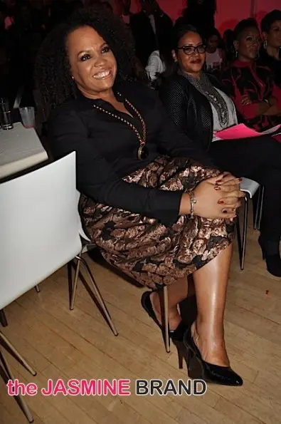 Lisa Price listens as Gary Dourdan intros her