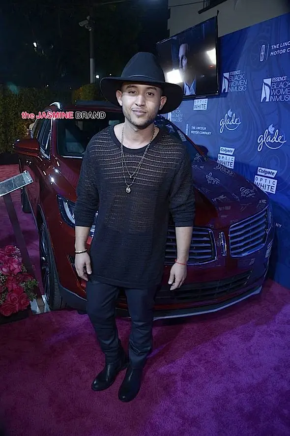 6. Actor Tahj Mowry poses with the 2015 Lincoln MKC on the red carpet