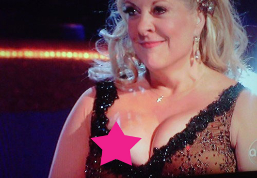 Nancy Grace's Brown Nipple Pops Out During Performance