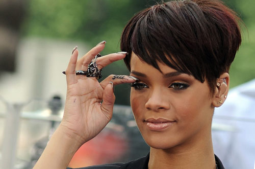 And some suggest that she was inspired by Rihanna's'Shhh' finger tattoo