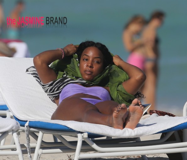Kelly Rowland takes to Miami Beach in a purple bikini