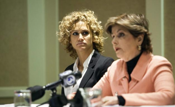 Hope Davila (L), who claims she was assaulted at a hotel by her former boyfriend, former NFL star Hugh Douglas, looks on during a news conference to announce a lawsuit filed in the United States District Court in Connecticut, with her attorney Gloria Allred (R) in Hartford, Connecticut April 28, 2014. Douglas, a former NFL football player for the New York Jets, Philadelphia Eagles and the Jacksonville Jaguars, in February 2014 pleaded no contest .