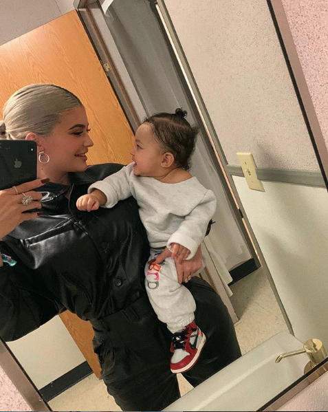 Kylie Jenner Tries To Get Baby Stormi To Promote Cosmetics Line [VIDEO]