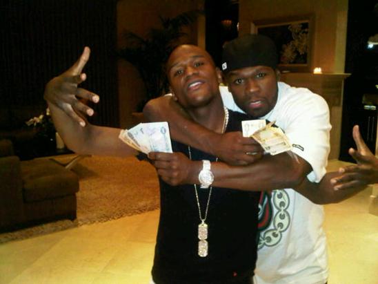 Floyd Mayweather showing off his hustle by rockin a huge