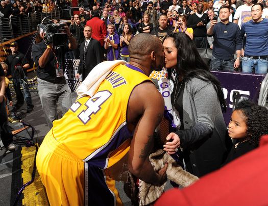 Kobe_Bryant_kisses_his_wife_Vanessa_Bryant_following_a_Lakers_win_at_Staples_Center-1-