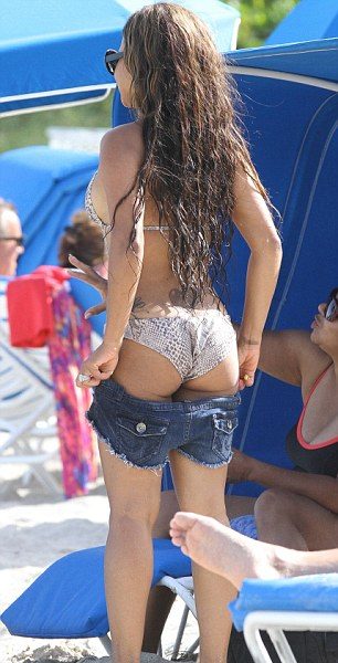 Stop & Stare : Christina Brings Snakeskin, Tatts & Cut-Outs Swimwear to the Beach