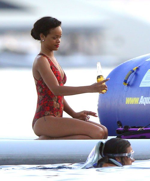Rihanna Goes Red, Rocks Conservative One Piece Bathing Suit