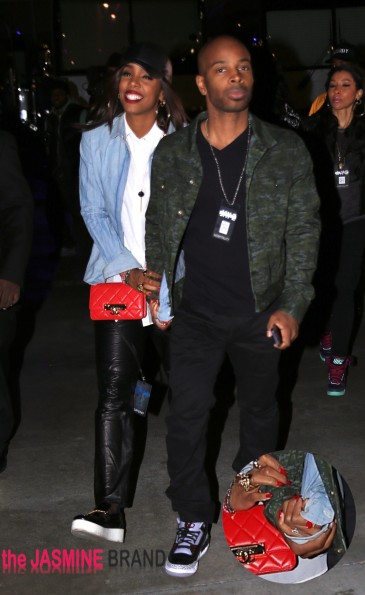 Kelly Rowland and fiance Tim Witherspoon hold hands as they leave the Jay Z concert at the Staples Center in Los Angeles on Monday night