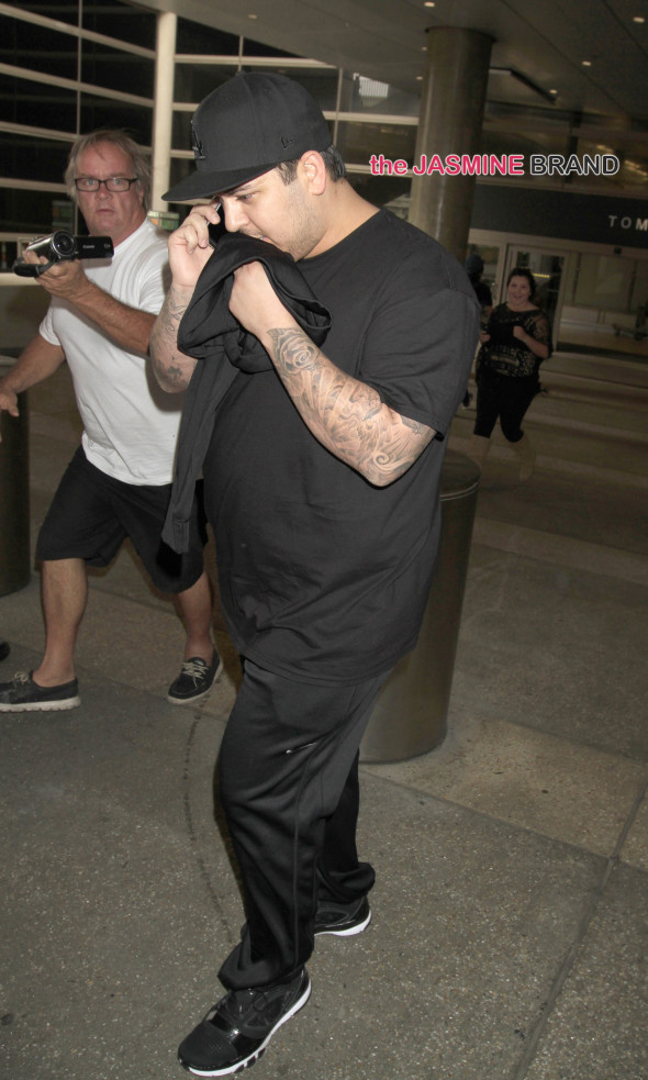 Rob Kardashian skips his sister, Kim Kardashian's wedding as he's seen landing at LAX on the day his sister is supposed to marry Kanye West in Paris, France