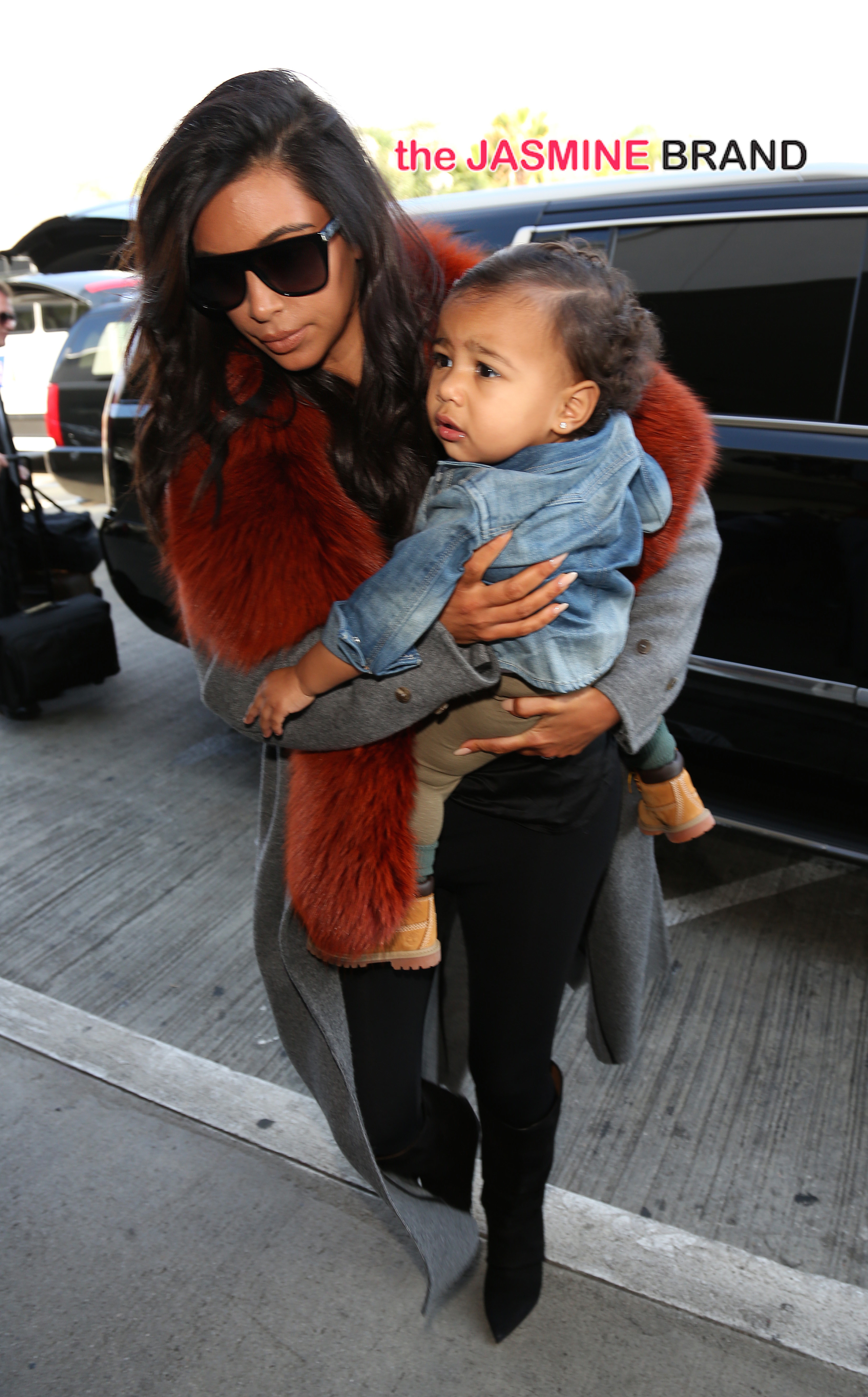 Kim Kardashian and baby North leaving LAX Airport, Kim Was in a long coat