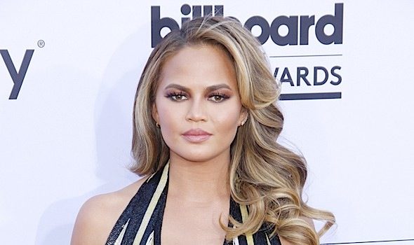 Chrissy Teigen Calls Out Racist Paparazzi: He asked if we evolved from monkeys!