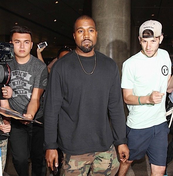 Kanye West Catches A Ride From Paparazzi [VIDEO]