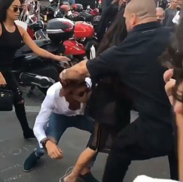 Kim Kardashian Ambushed By Prankster Trying To Kiss Her Booty [VIDEO]