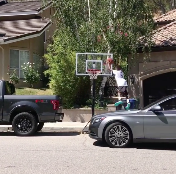 Yikes! Gilbert Arenas & Laura Govan’s Son Jumps Off Moving Car To Dunk A Basketball