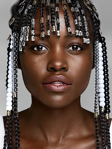 Kendrick Lamar with actress Lupita Nyong'o at Paris Fashion Week.