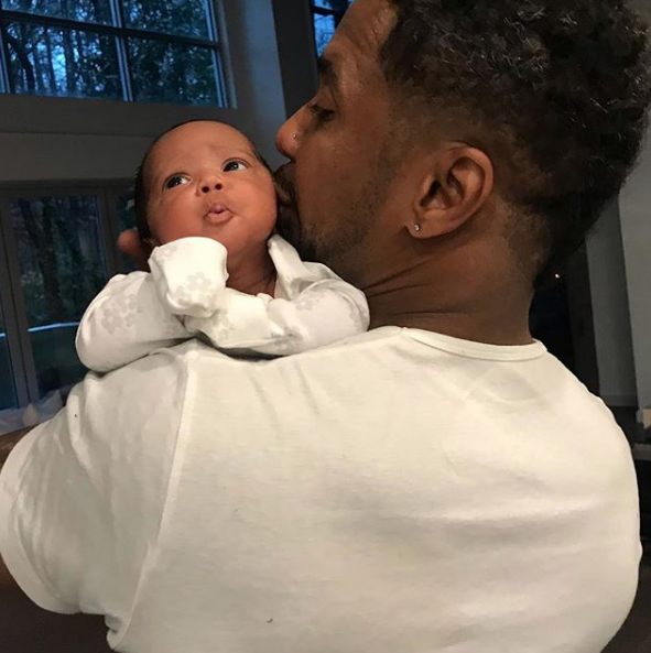 Kenya Moore’s Husband Cradles Baby Girl Brooklyn [Photo]