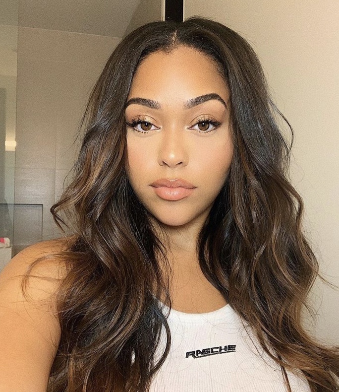 Jordyn Woods channels Jessica Rabbit in a VERY low-cut dress and red hair  in her social media post