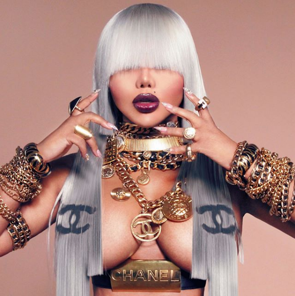 Lil Kim Stuns In MCM, Poses Topless In New Chanel Designed Hair